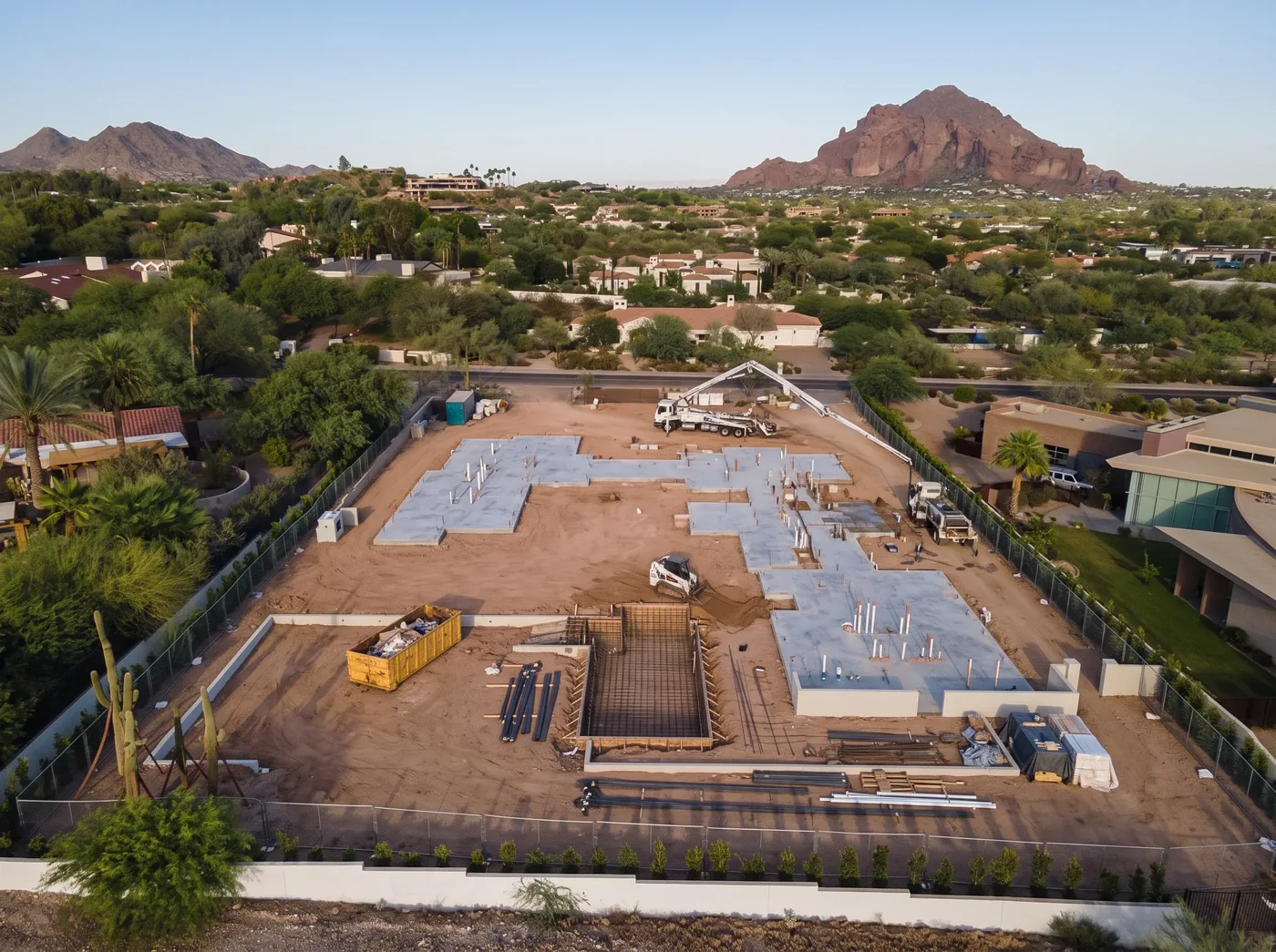 Foundation slabs poured on a graded Phoenix lot — illustrative rendering